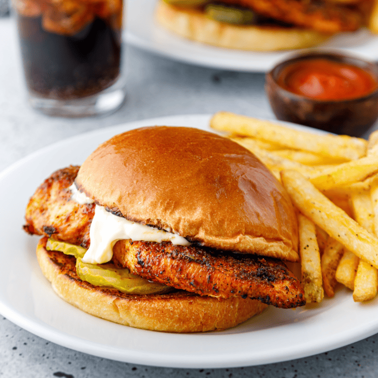 Air Fryer Popeyes Blackened Chicken Sandwich served with crispy seasoned chicken on a toasted bun.