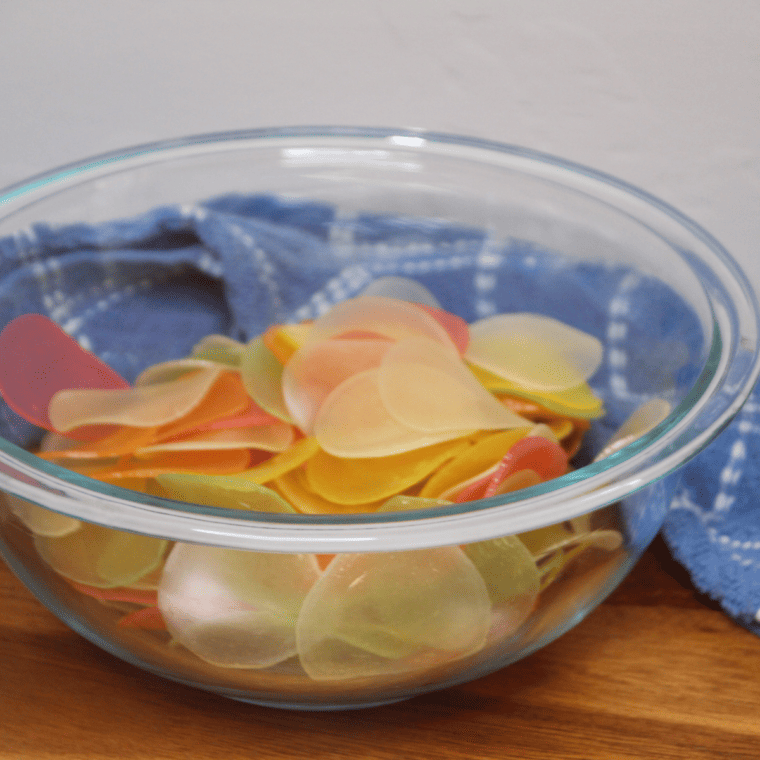 Laying out uncooked prawn crackers on a flat surface before air frying