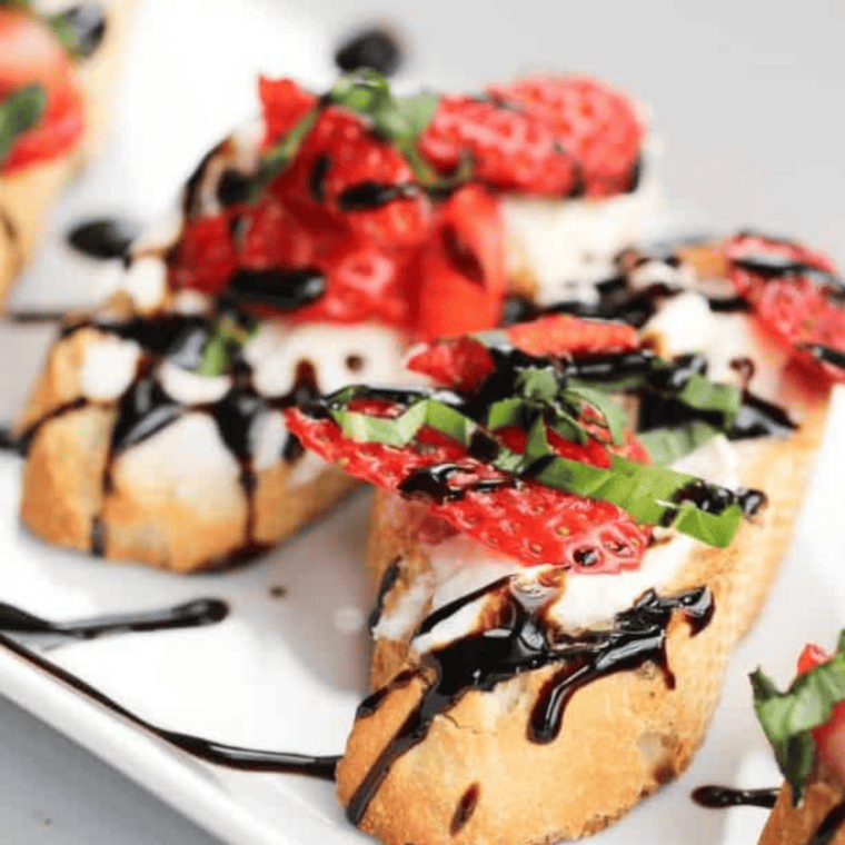 Overhead view of strawberry mascarpone bruschetta pieces ready to serve