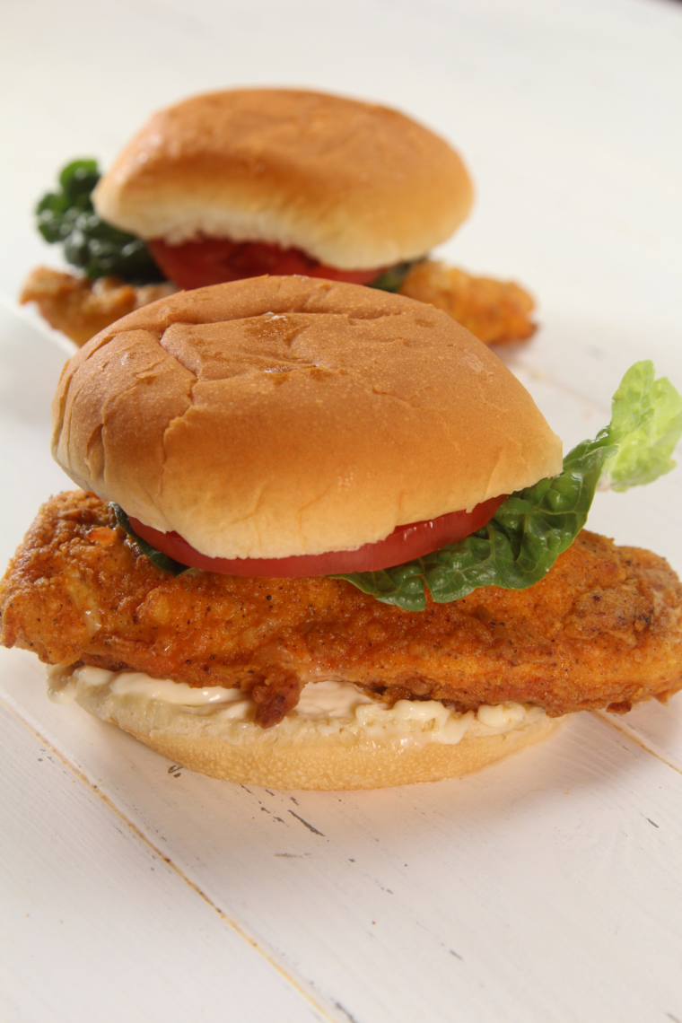 Air Fryer Wendy's Spicy Chicken Sandwich served with crispy chicken breast, pickles, lettuce, tomato, and creamy mayonnaise on a soft bun.