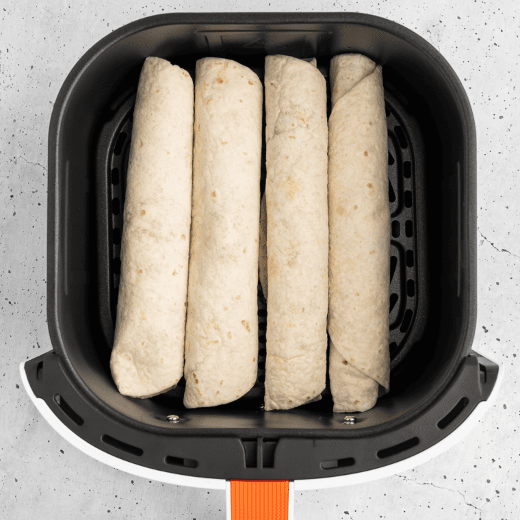 Place the pizza roll ups in the air fryer basket.