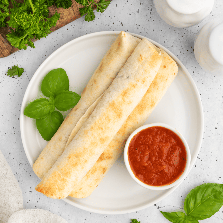 Serve the Air Fryer Pizza Roll Ups with marinara sauce for dipping.