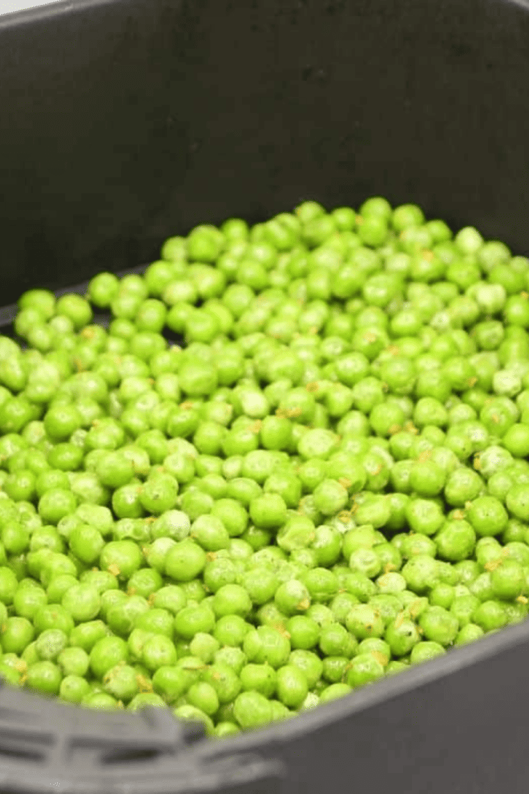 Crispy and golden air fryer green peas, ready to be served as a healthy snack or side dish.