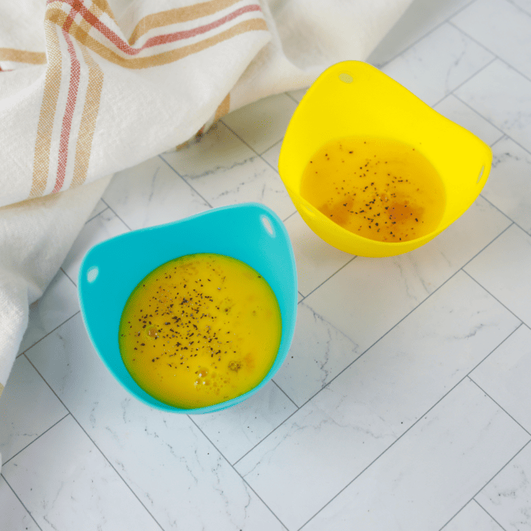 Preheating air fryer to 300–330°F for gently baked eggs with tender whites and soft yolks without overcooking