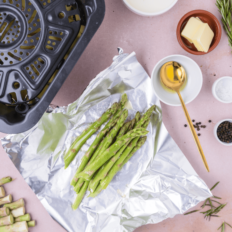 Drizzle asparagus with olive oil, season with salt and pepper, and toss to coat evenly.