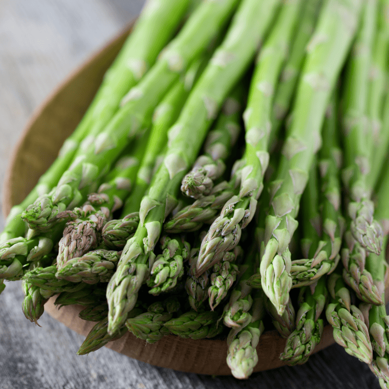 Rinse asparagus and trim tough ends, optionally peel stems for tenderness.