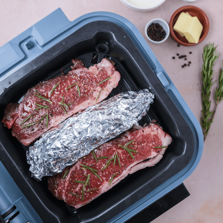 Roasting seasoned asparagus in a single layer in the Ninja Speedi air fryer.