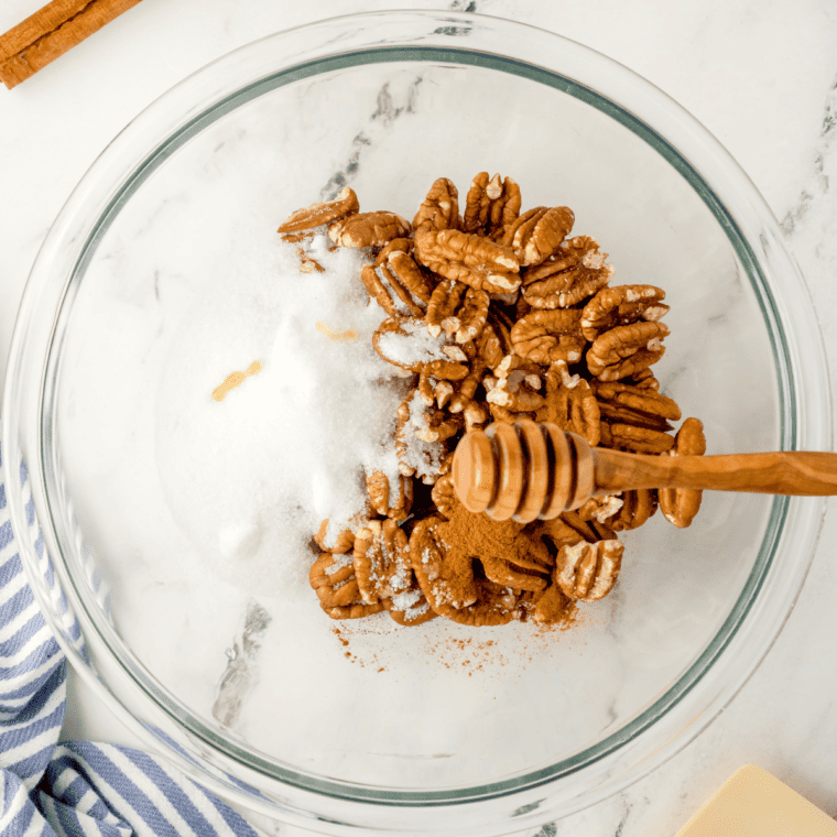 Toss the pecans with oil and seasonings.