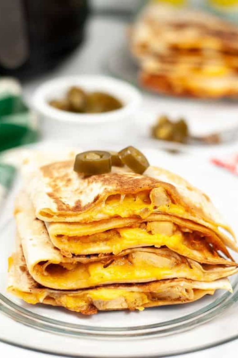 Crispy air fryer quesadilla filled with chicken melted cheese and sauce