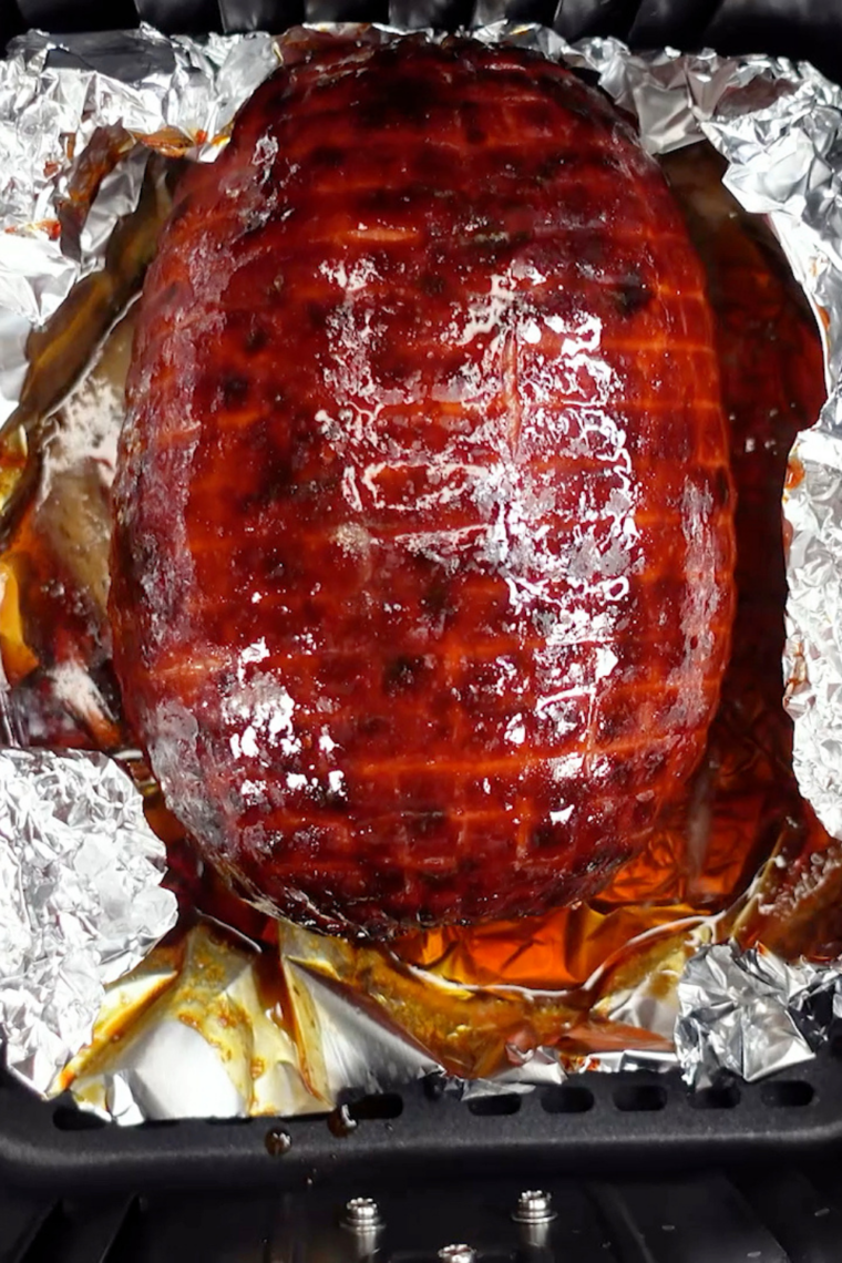 Air Fryer Honey Glazed Baked Ham with a golden, caramelized glaze, served on a platter with garnishes.
