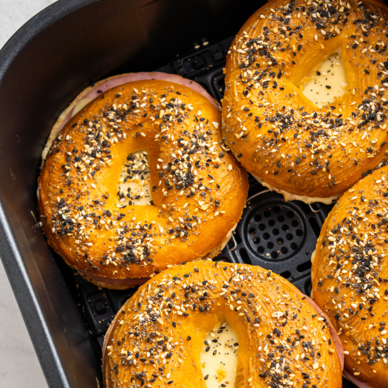 Freshly air-fried bagel breakfast sliders, showcasing a golden, crispy exterior and savory fillings