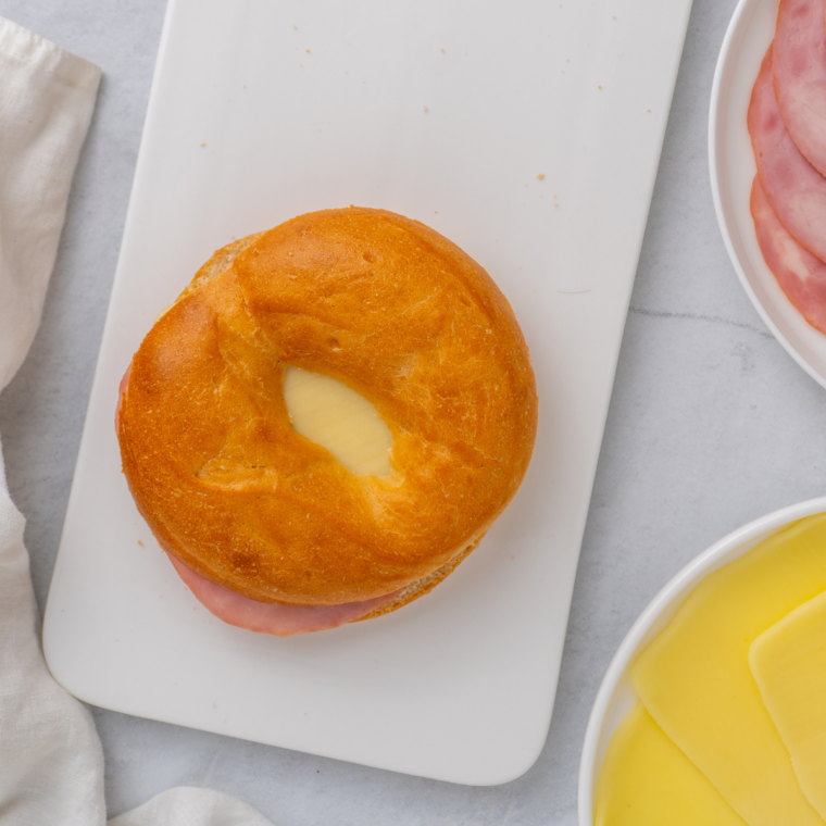 Air Fryer Bagel Breakfast Sliders on a cutting board.