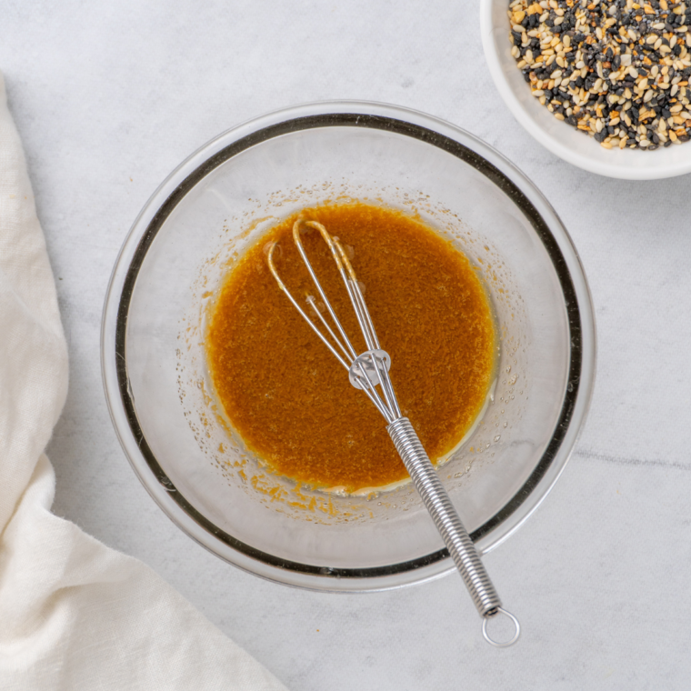 Prepare the topping for the breakfast sliders. In a clear bowl with whisk in the bowl.