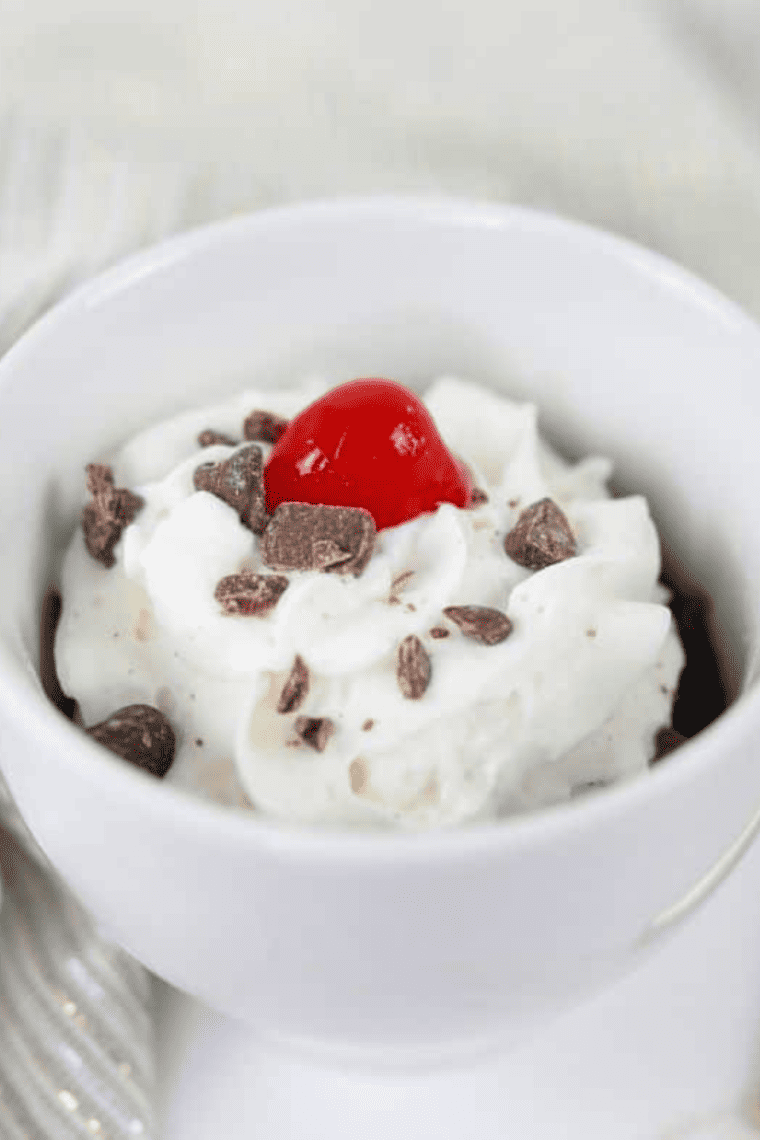 Fudgy air fryer brownie in a mug served warm with gooey chocolate center, quick single-serve dessert made in ceramic mug for easy treat