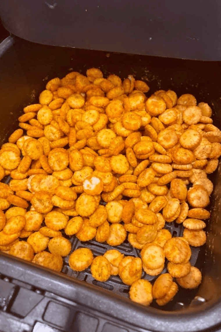 Air Fryer Buffalo Oyster Crackers coated in spicy buffalo seasoning, golden and crispy