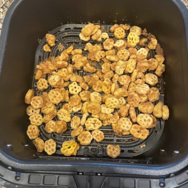 Crispy golden Air Fryer Churro Honeycomb Snack Mix fresh from the air fryer