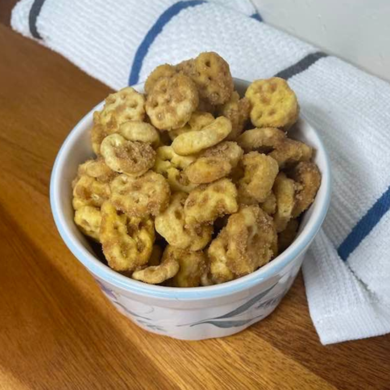 Close-up of Air Fryer Churro Honeycomb Snack Mix showing the cinnamon sugar coating