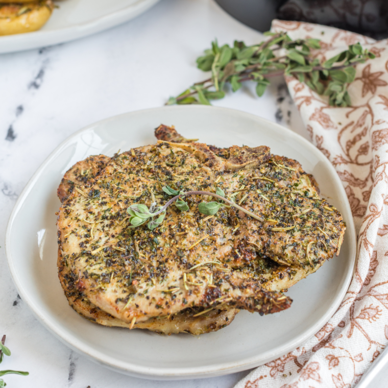  Air Fryer Italian Pork Chops, golden and crispy, seasoned with Italian herbs, ready to serve for a tasty, quick meal.