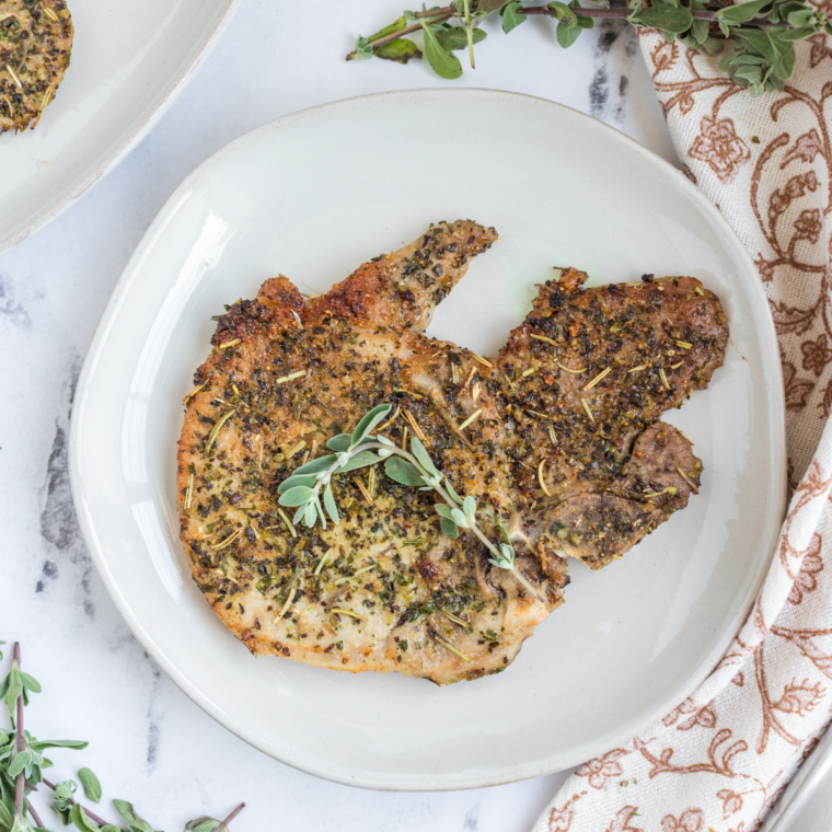Air Fryer Italian Pork Chops, crispy and golden, seasoned with Italian herbs, ready to enjoy for a flavorful meal.