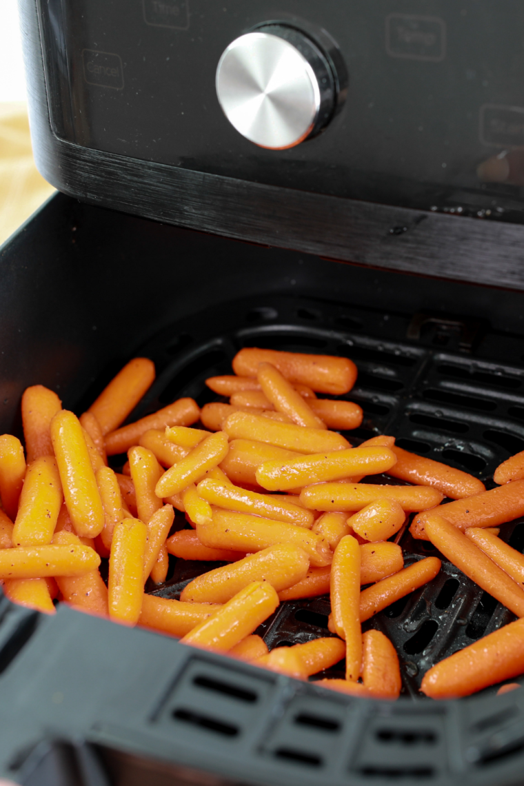 Cooking Air Fryer Ranch Carrots - "Air fryer in action with Ranch Carrots cooking inside."
