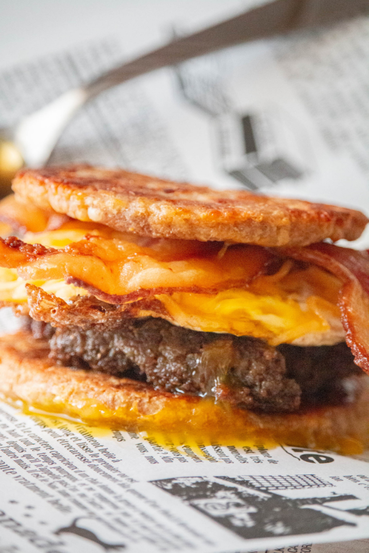 "Air Fryer Copycat Sausage McGriddle with pancakes, sausage, and cheese stacked together"
