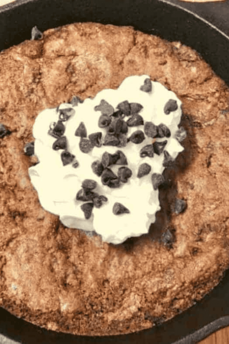 A warm Air Fryer Skillet Brownie being enjoyed with a fork, showing its rich and soft interior