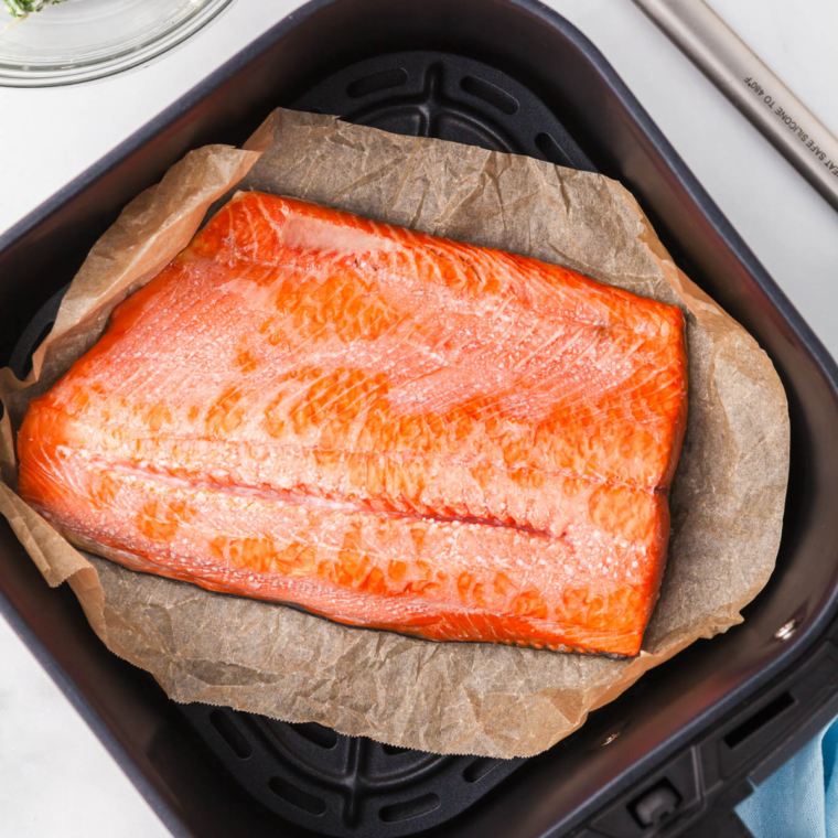 Cooked sockeye salmon flaking with a fork at 145°F, golden and tender