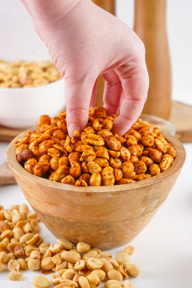 Making Planters Heat Peanuts (Copycat) with peanuts being coated in spices and prepared for roasting.