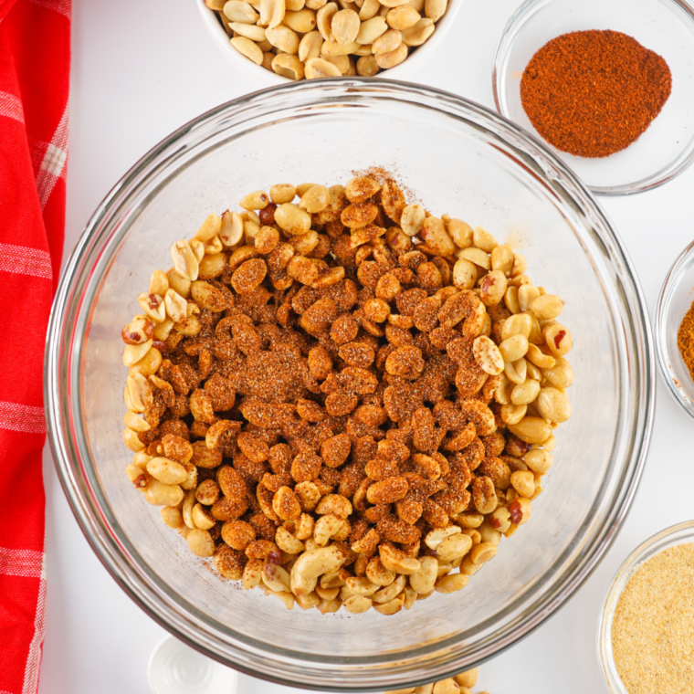 Coating peanuts with spicy seasoning mix for Planters Heat Peanuts.