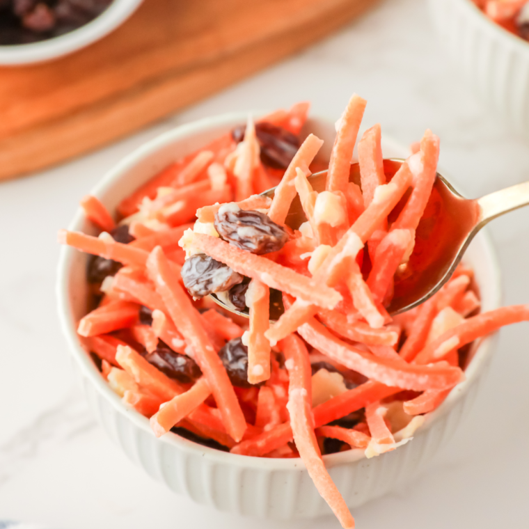 Chick-fil-A style carrot and raisin salad with shredded carrots, raisins, pineapple chunks, and creamy dressing.