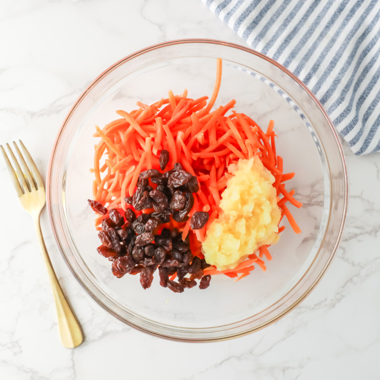 Preparing shredded carrots for Chick-fil-A carrot and raisin salad