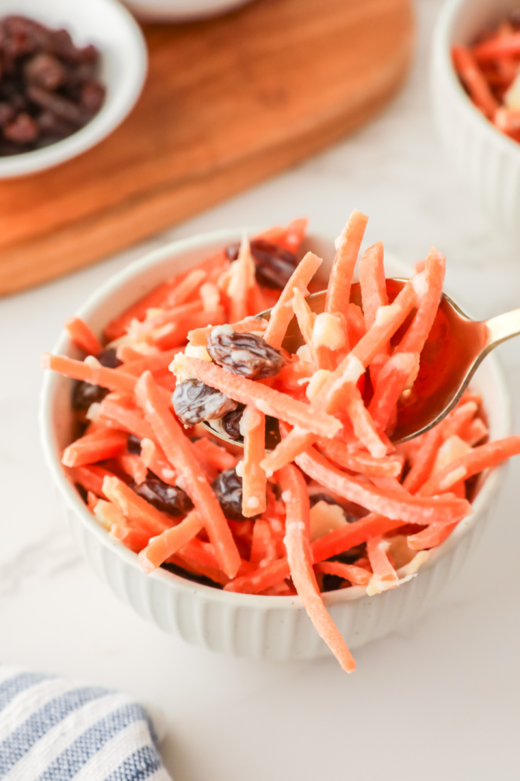 Chick-fil-A style carrot and raisin salad with shredded carrots, raisins, pineapple chunks, and creamy dressing.