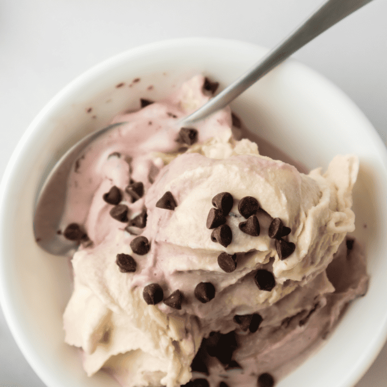 Scoops of Ninja Creami boozy Cherry Garcia ice cream with cherries and chocolate chunks