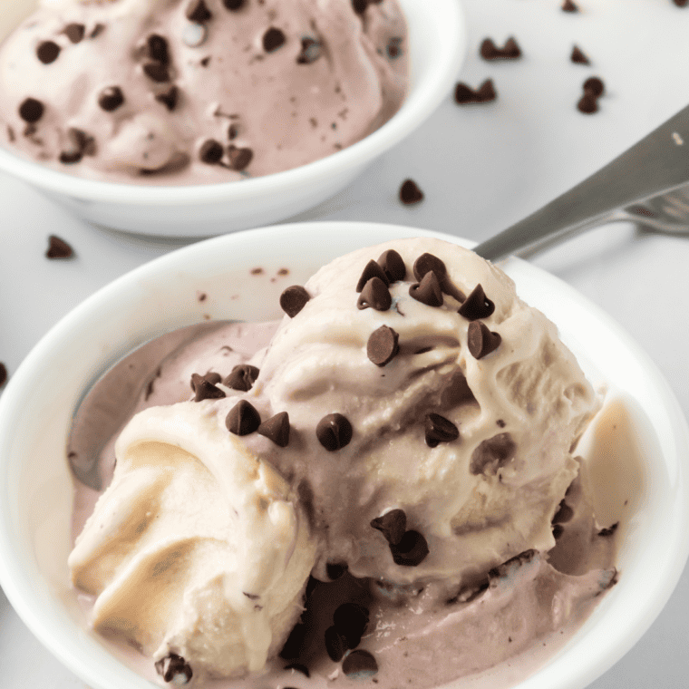Ninja Creami Boozy Cherry Garcia Ice Cream in a bowl with extra chocolate chips on top.