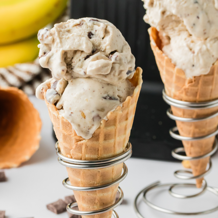Bowl of Ninja Creami Copycat Ben & Jerry’s Chunky Monkey ice cream with chocolate chunks and walnuts.
