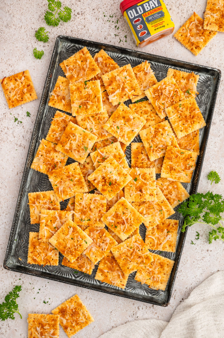 Crispy air fryer Old Bay-seasoned saltine crackers topped with melted cheese