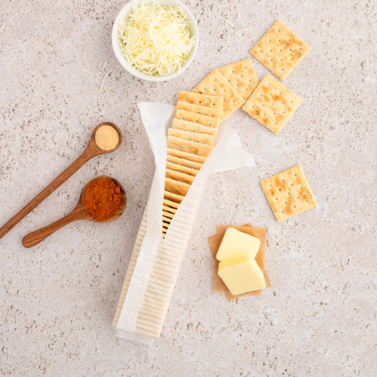 Ingredients needed for Air Fryer Old Bay Saltine Crackers on kitchen table.