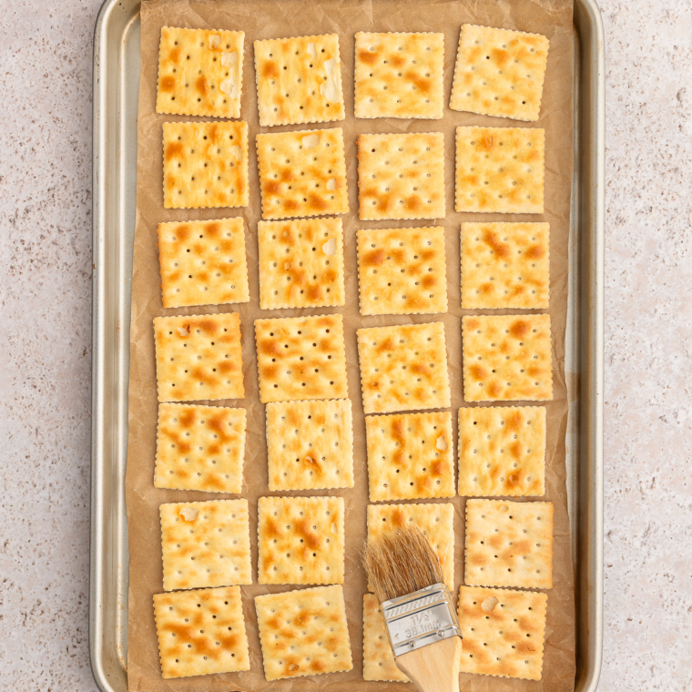Saltine crackers brushed with melted butter and seasoned with garlic powder and Old Bay
