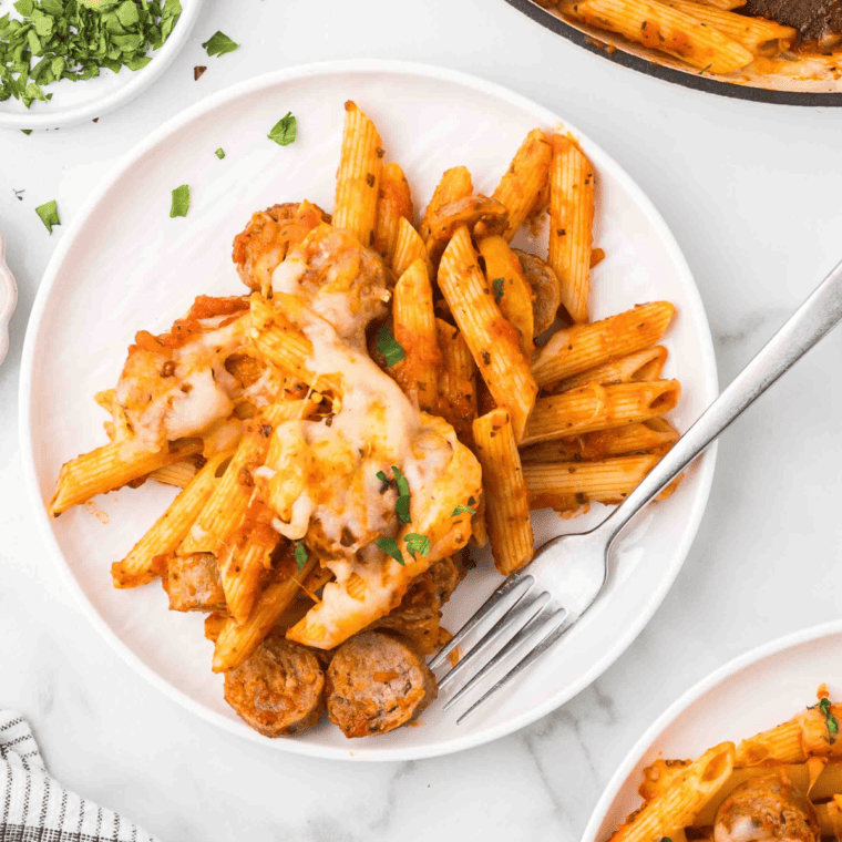 bowl of sausage pasta made with Trader Joe’s sausage, creamy sauce, herbs