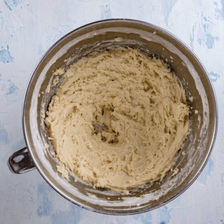Cutting cheese scone dough into rounds on a floured surface
