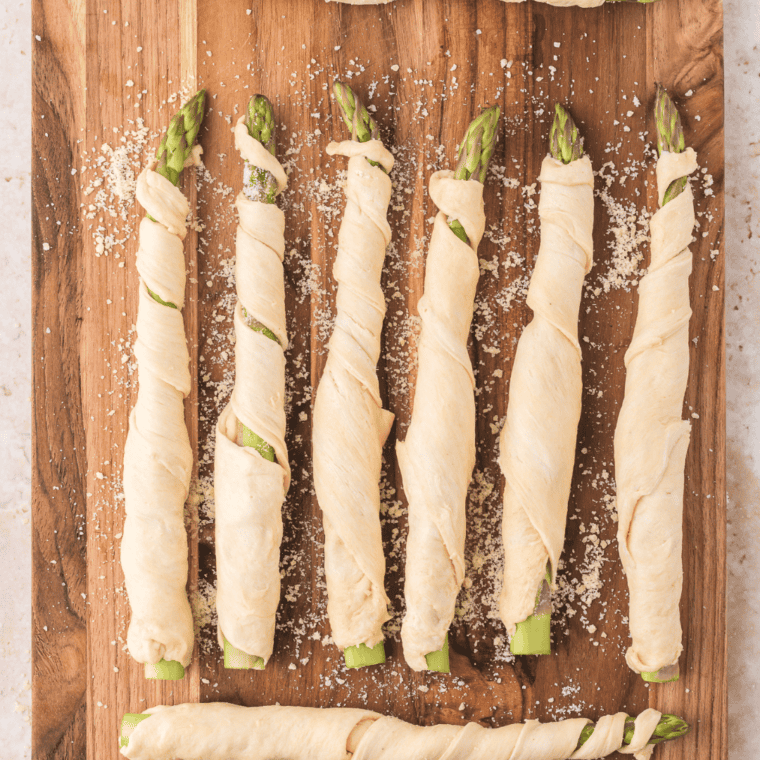 Brush asparagus crescent rolls with butter and sprinkle Parmesan.