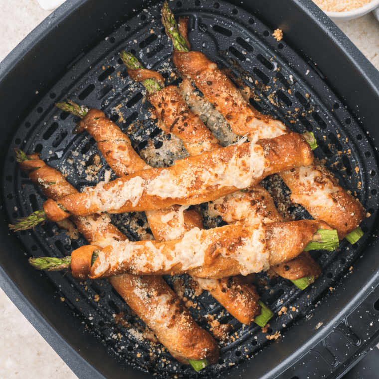 Air fryer asparagus crescent rolls, golden brown, crispy, and ready to serve.