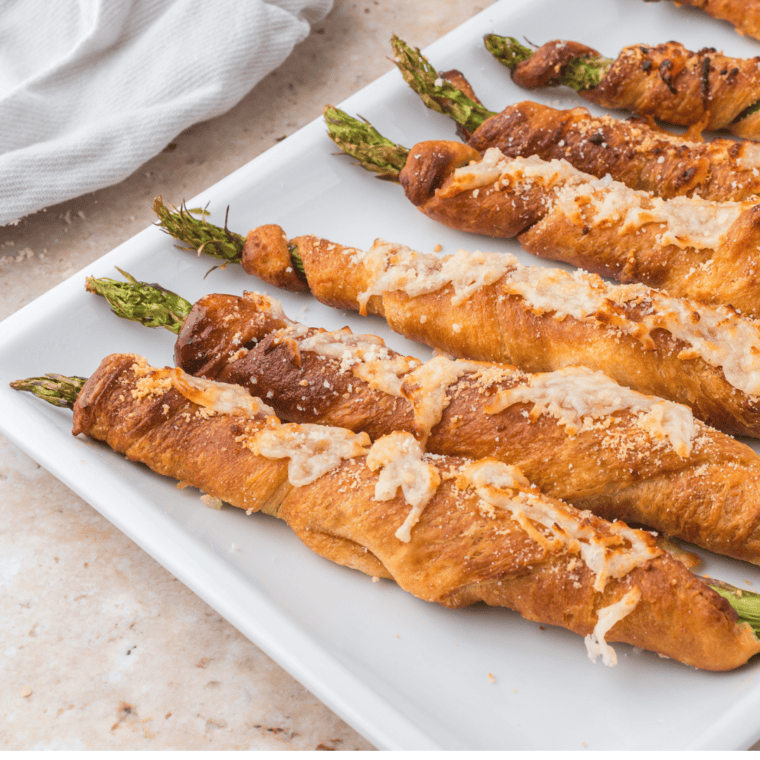 Golden, crispy asparagus crescent rolls cooked in the air fryer, ready to serve.