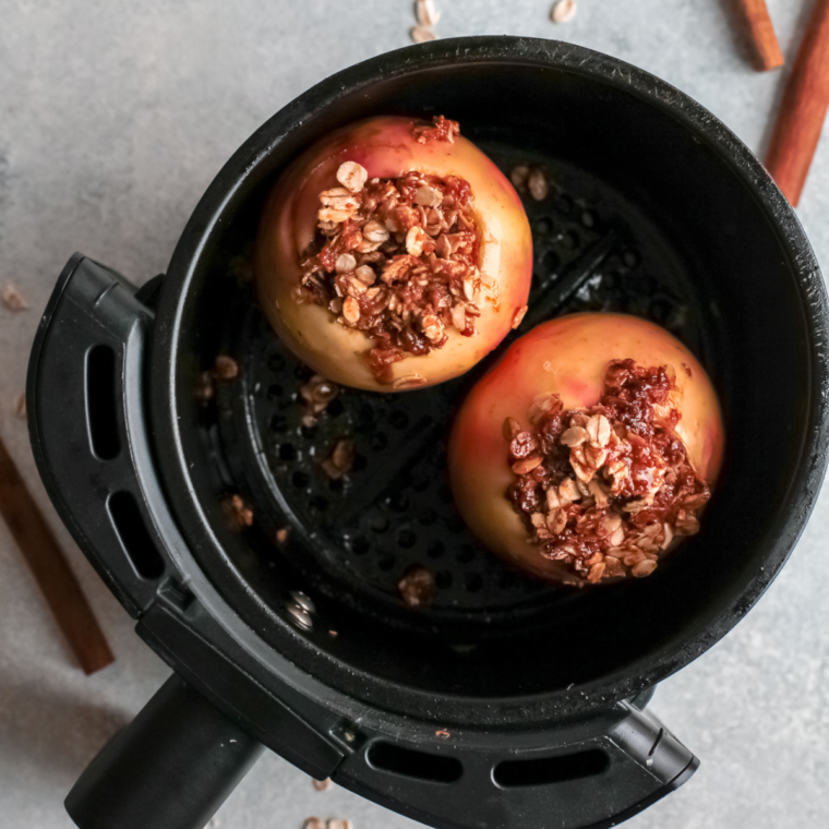 Warm baked apples served with vanilla ice cream and caramel drizzle, fresh from the air fryer.