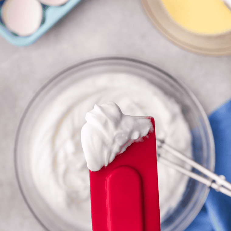 Beat the mixture, until it's soft and resembles a cloud.