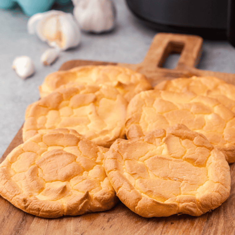 Air Fryer Cloud Bread sliced open, displaying the delicate and airy texture inside.