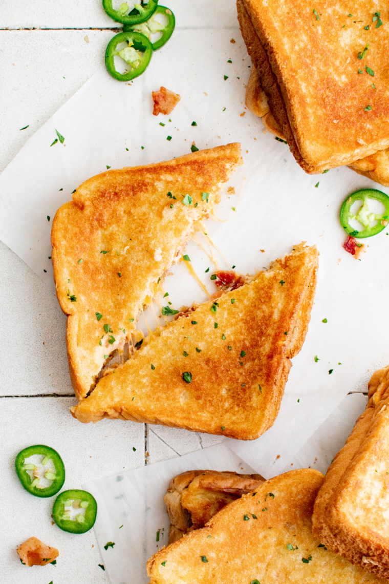 Air Fryer Jalapeño Popper Grilled Cheese sandwich with melted cheese, jalapeños, and golden crispy bread.