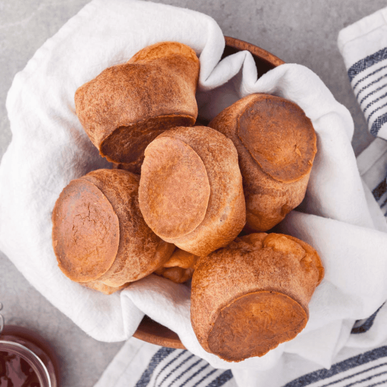 Golden, fluffy air fryer popovers freshly baked and puffed, ready to serve