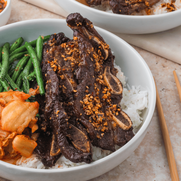 Grilled Trader Joe’s Korean short ribs served with rice and garnished with green onions.

