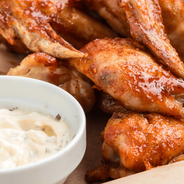 Golden, crispy KFC Honey BBQ Wings coated in sweet BBQ sauce.
